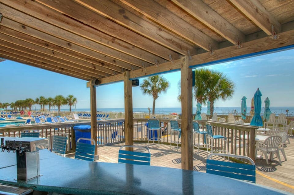 Grab a drink from the Tiki bar.