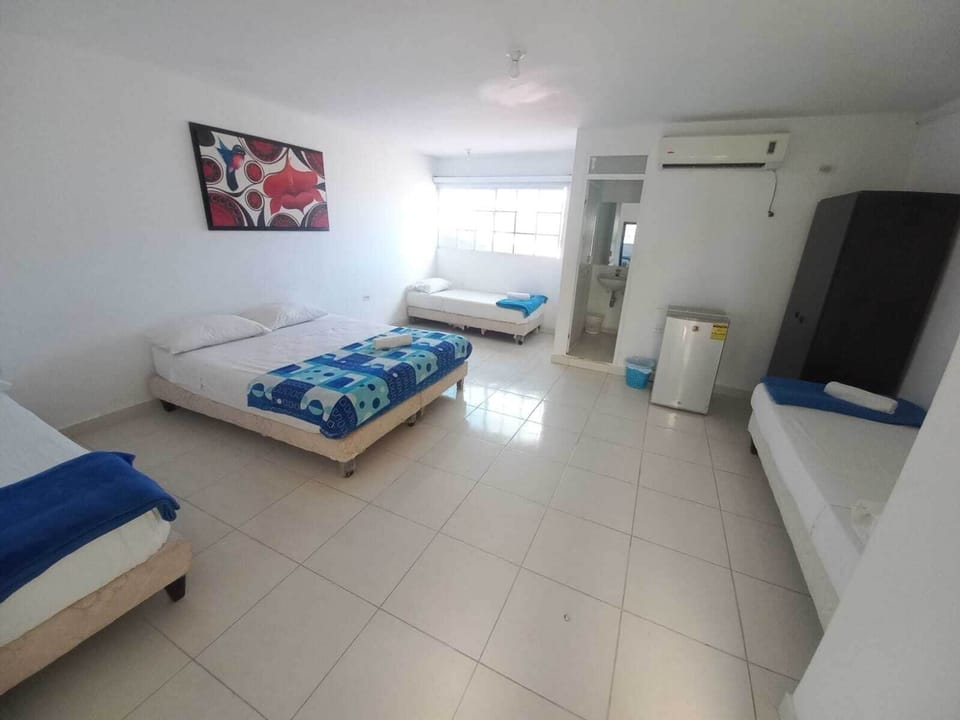 Family Room | Minibar, WiFi (free), bed sheets