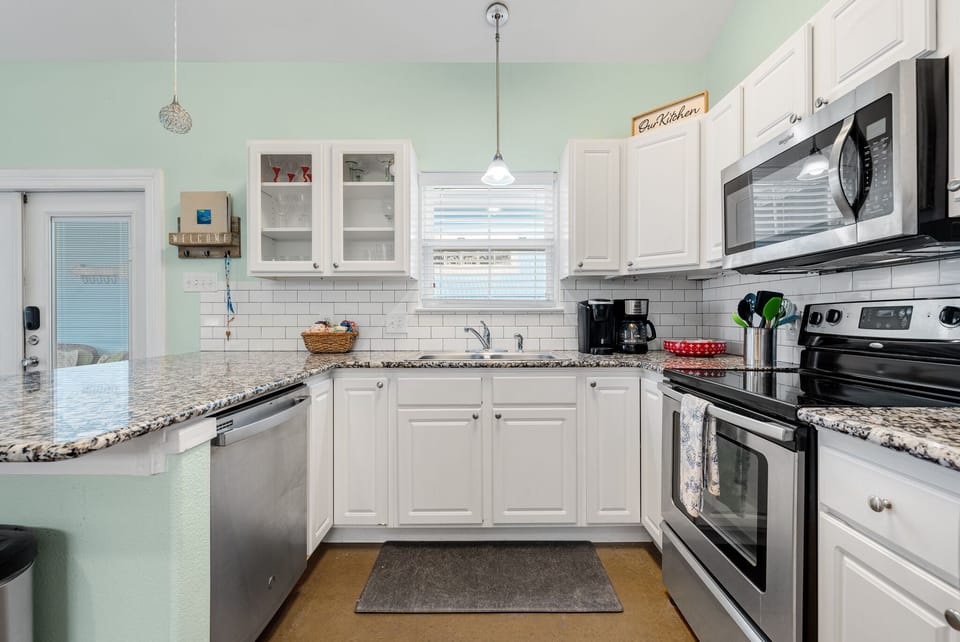 Spacious kitchen, fully stocked with plates, glasses, utensils etc.