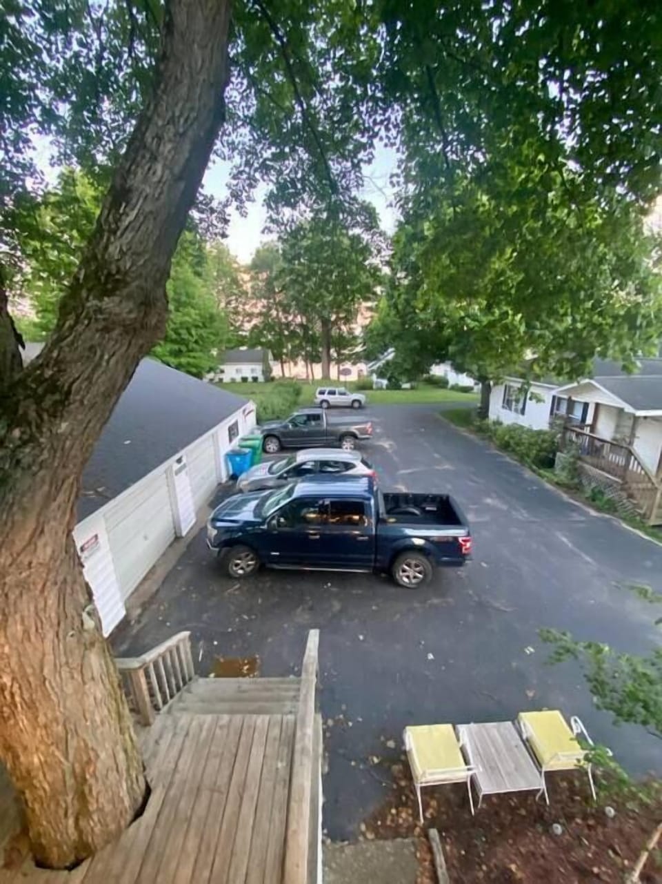 The lake access is past the cars in-between the two cottages. 