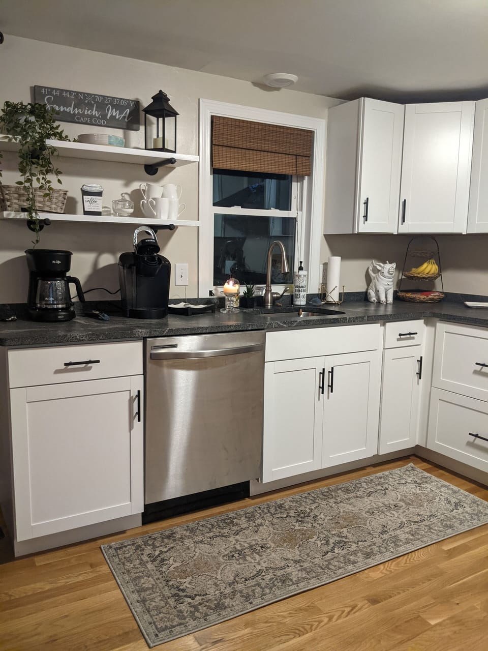 Well equipped kitchen with drip style coffee maker and single cup Keurig.