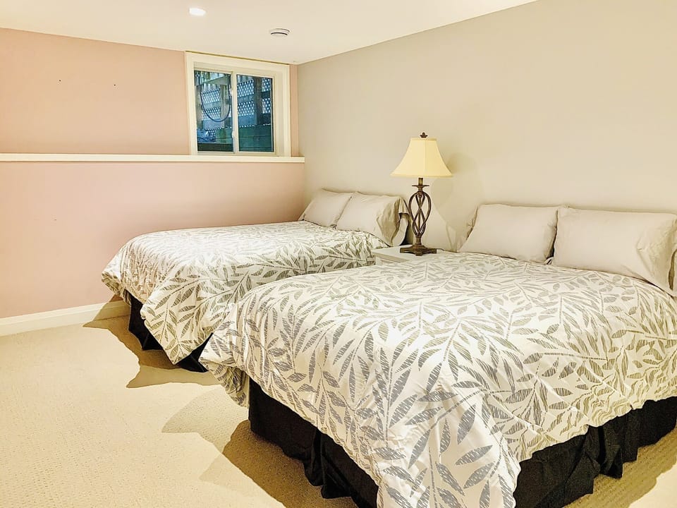 Bedroom # 3.  Basement bedroom with 2 double beds.