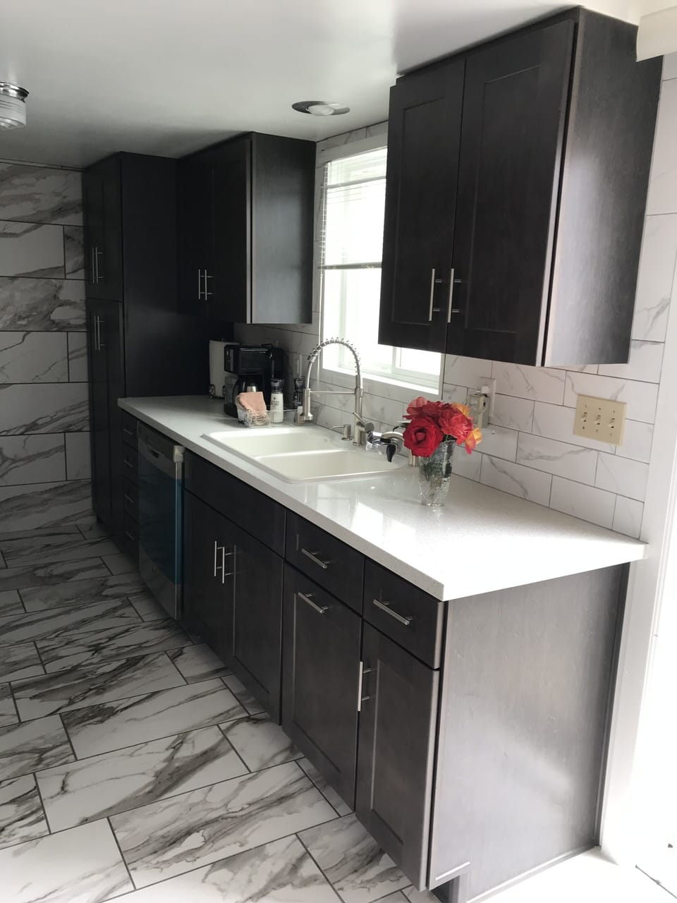Full kitchen with double sink and water filter.