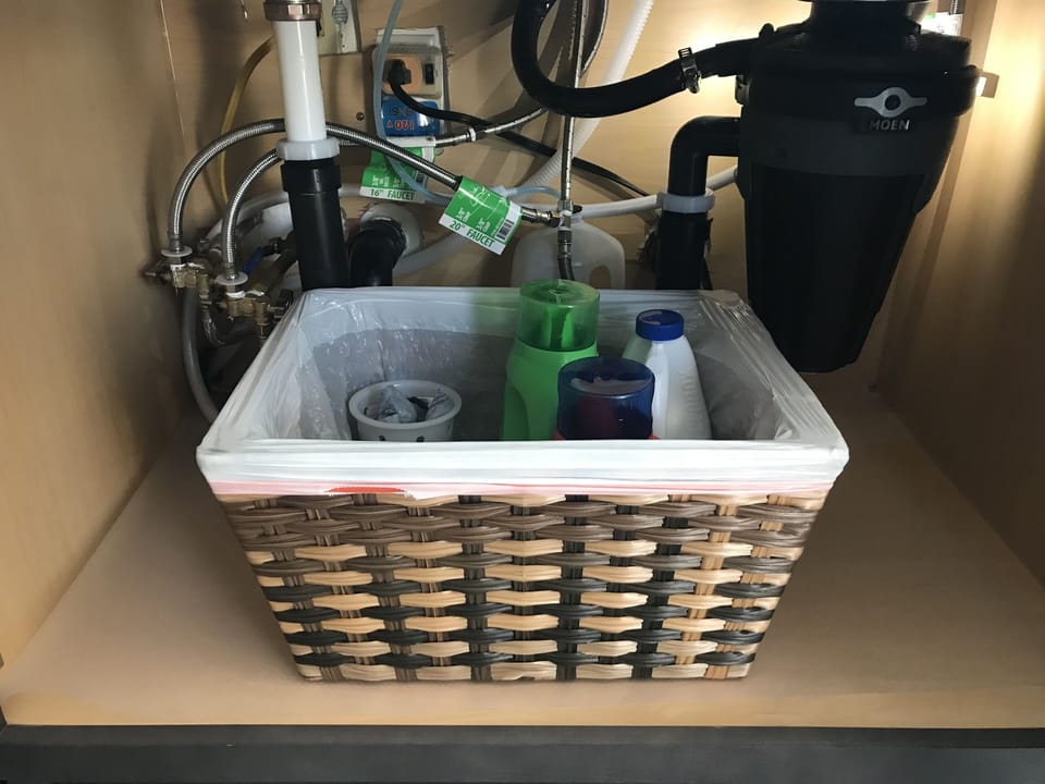 Laundry supplies under the kitchen sink