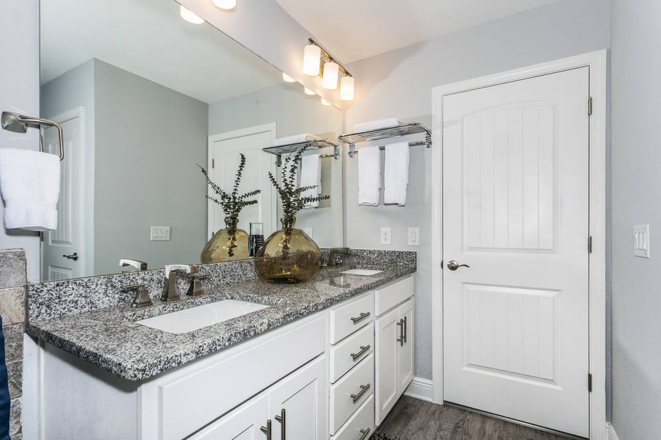 Beautiful master bathroom with a granite counter top double vanity