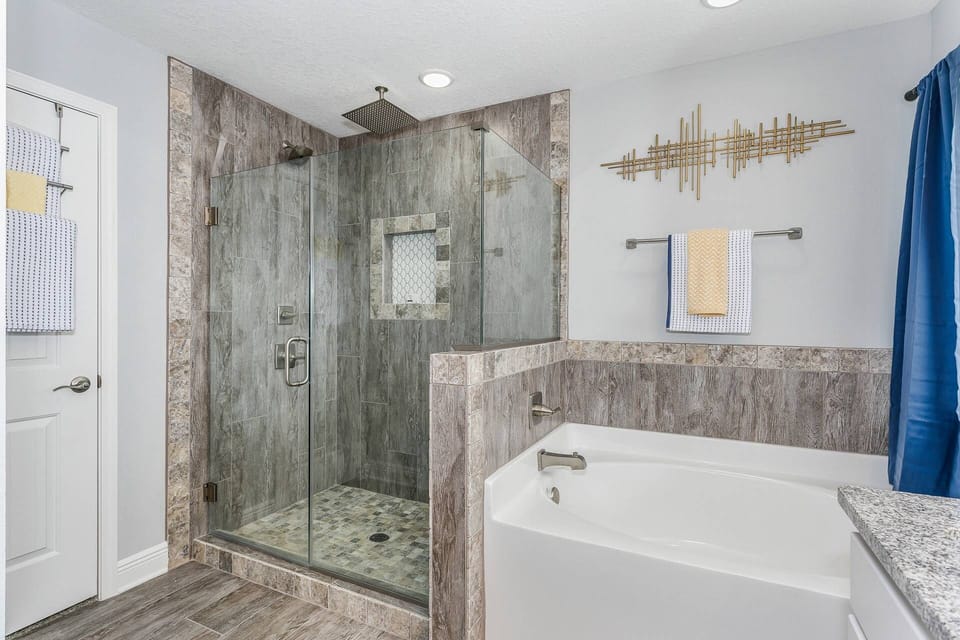 Huge master bathroom with separate tile shower and oversized tub