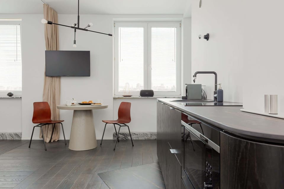 The living area's modern and stylish decor creates a welcoming atmosphere. 