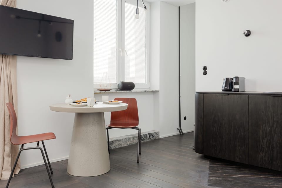 The living area's contemporary decor creates a chic and cozy environment. 
