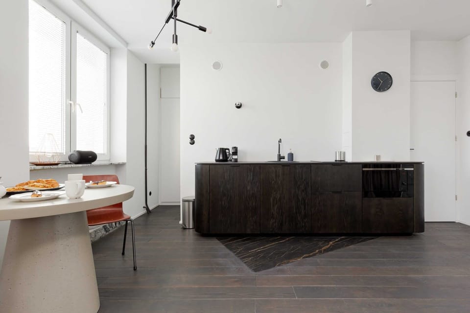 Cook and dine in style with the modern kitchenette and dining area.