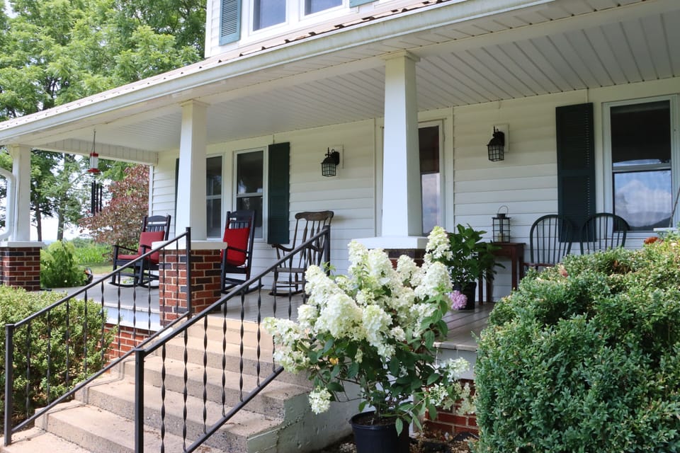 Front porch in summertime, iced T, hummingbirds, flowers and fireflies!