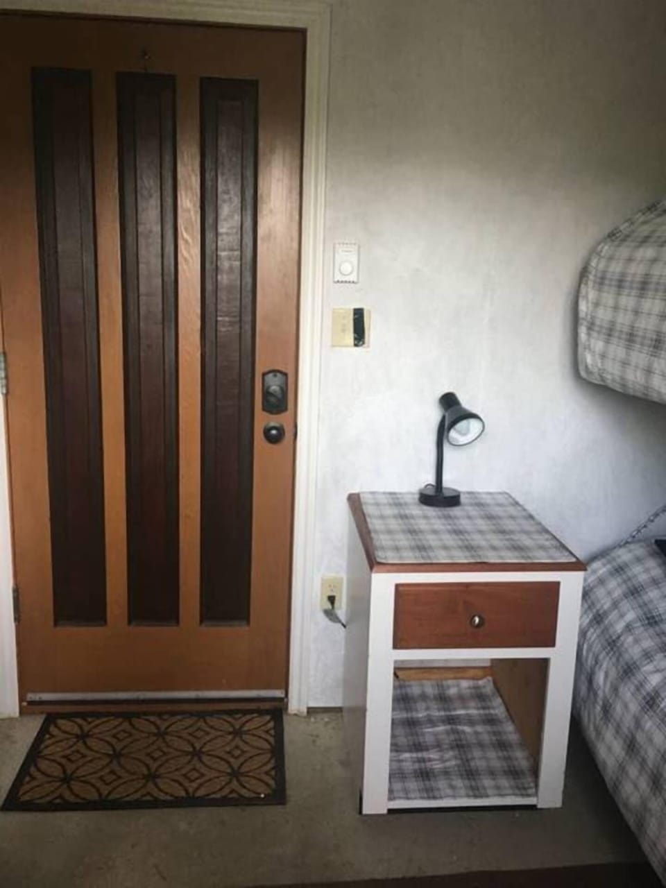 Bunkhouse entrance, side table and beds