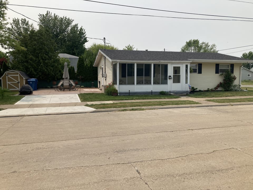 Front of 312 beech St., showing patio to the left side of house.