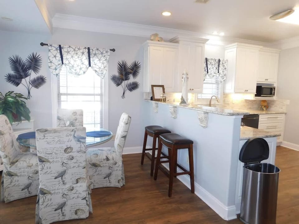 Bright kitchen and cozy dining nook with garden views