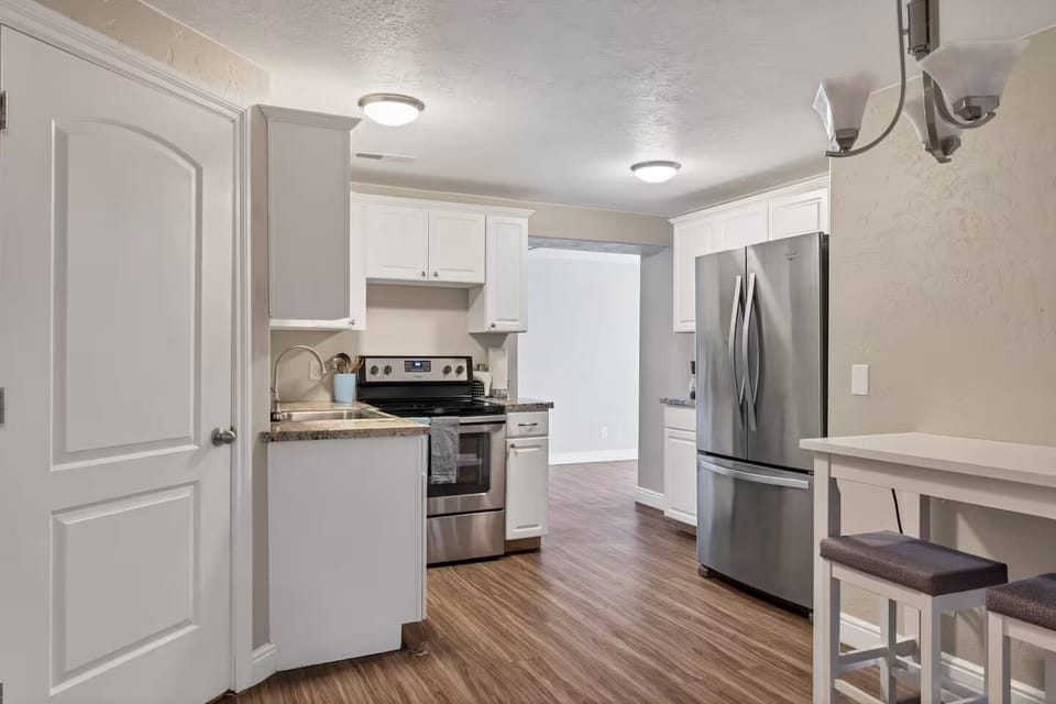 A butler's kitchen on the basement level. Full-sized kitchen, oven, stove + sink
