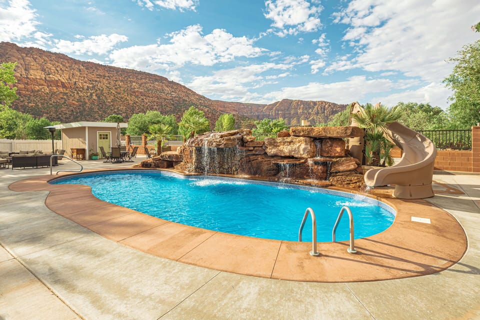 Pool w/ rock waterfall & slide- need we say more?! Option to heat (see listing)