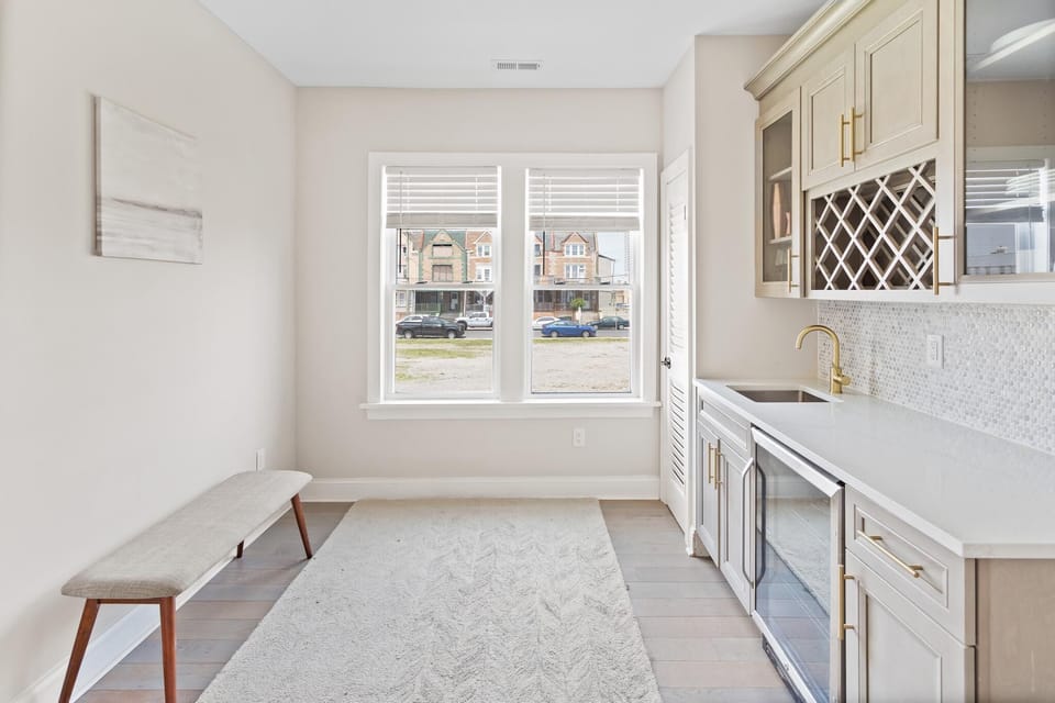Entertain in style with a modern wet bar equipped with a wine fridge