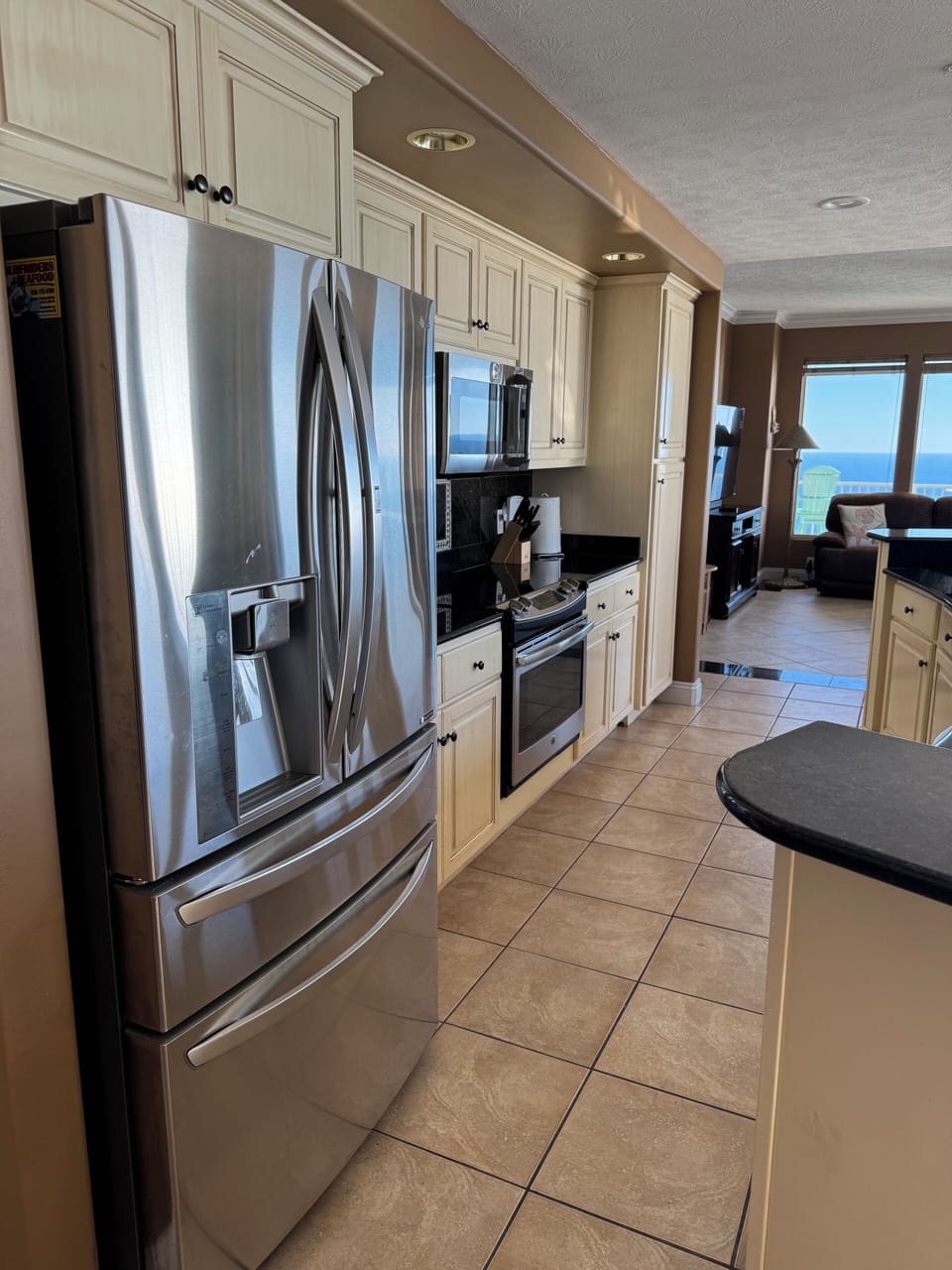 Large fridge with new oven.