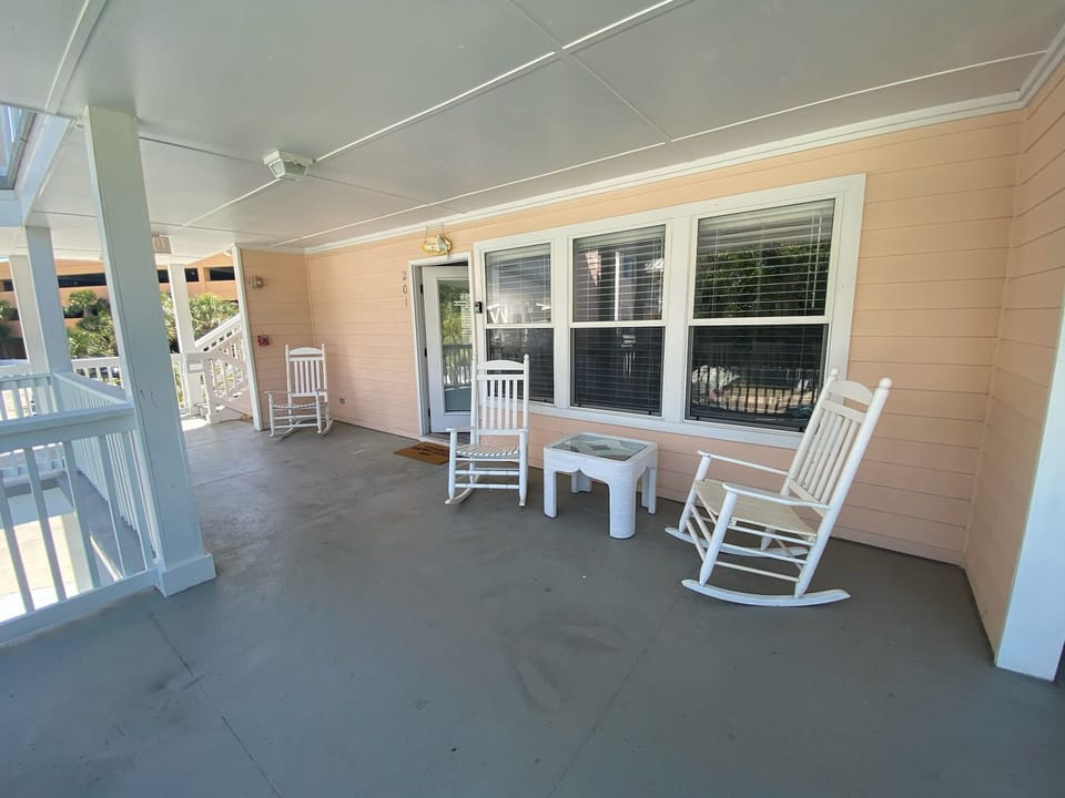 Large front porch facing pool