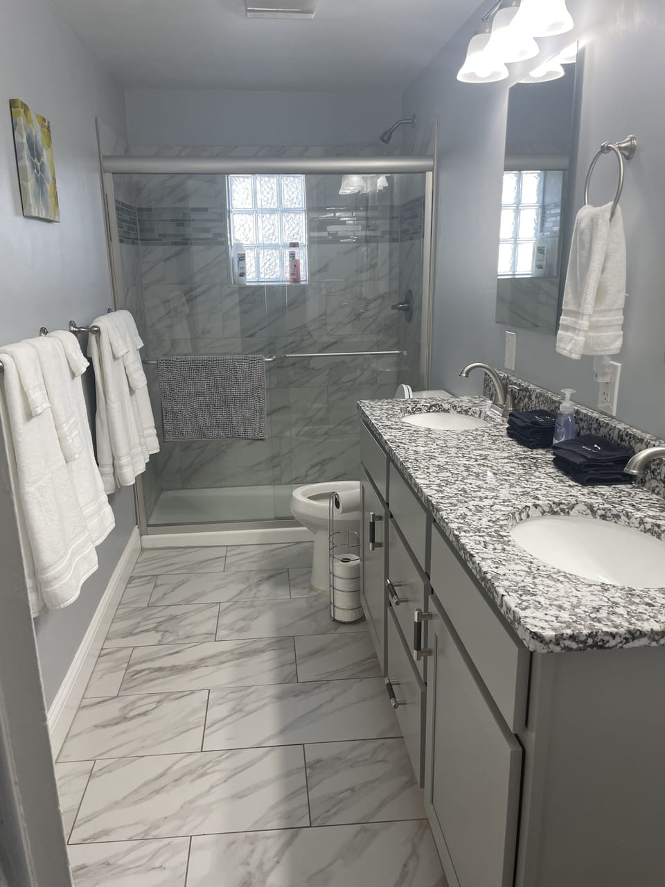 Fulll bathroom with walk in shower and double sink