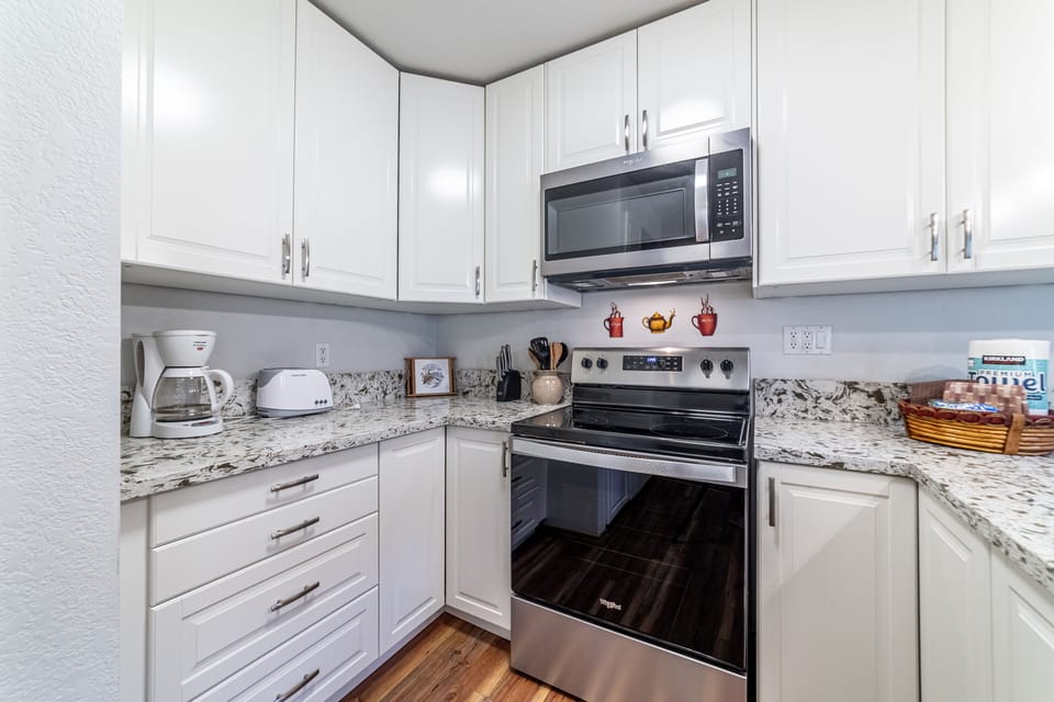 Kitchen comes fully stocked for all cooking needs.