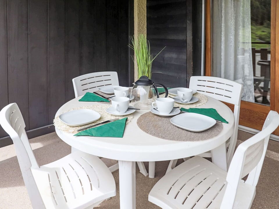 Table, Furniture, Chair, Tableware, Dishware, Outdoor Table, Outdoor Furniture, Textile, Rectangle, Wood