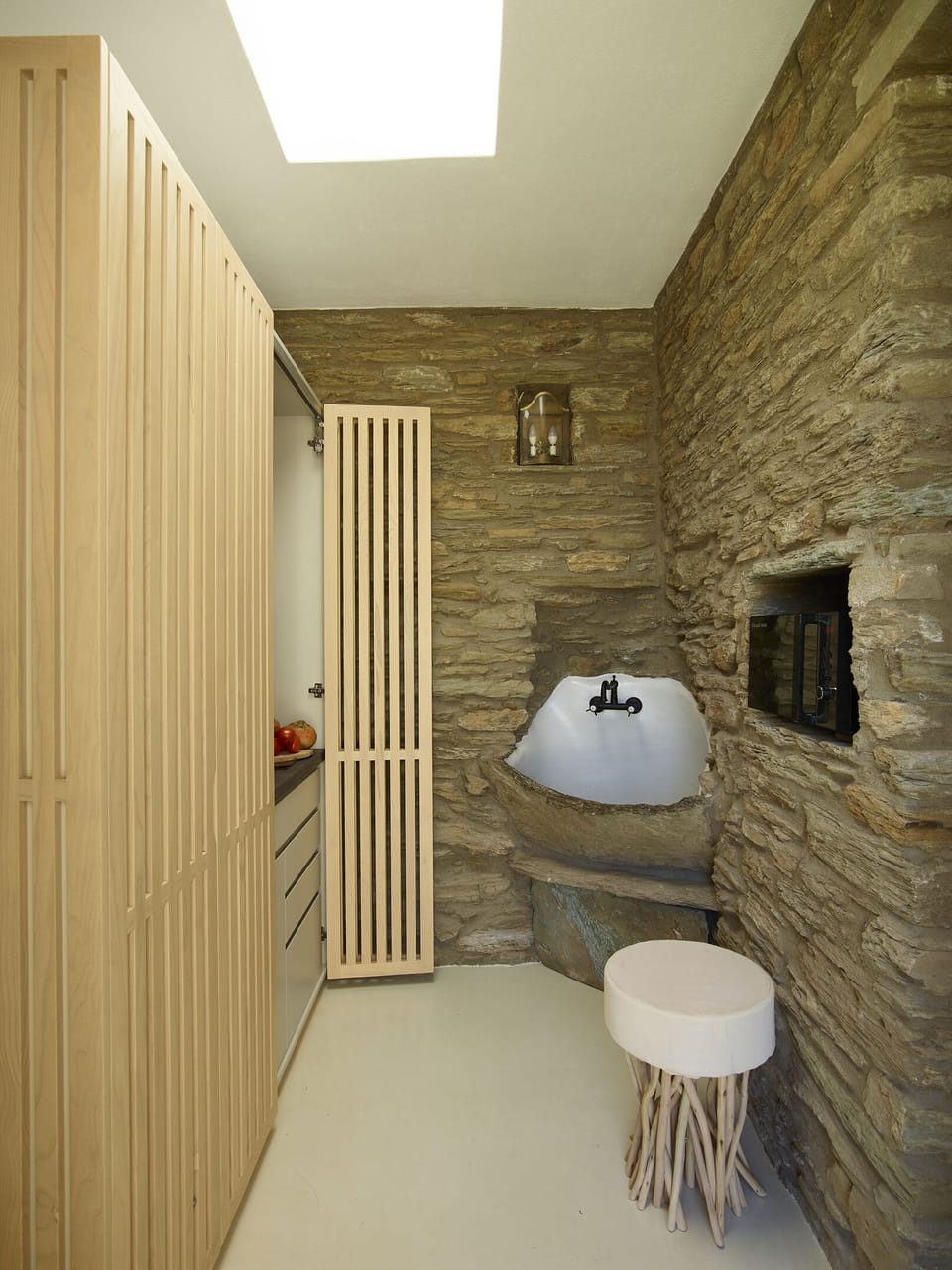 The Suite: A stylish, hidden kitchenette behind wood doors