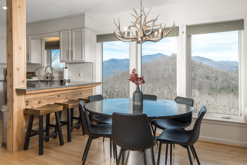 The remodeled kitchen and dining area make it easy to cook, gather, and enjoy the view at every meal.