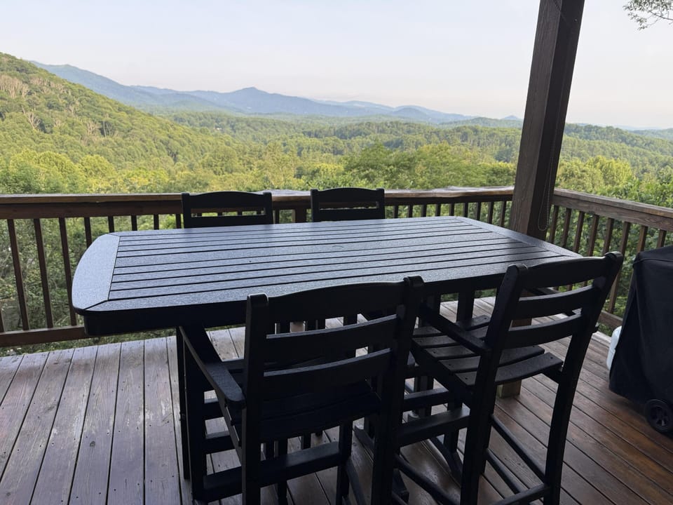 Dine outside on the covered deck and soak in the layered mountain scenery.