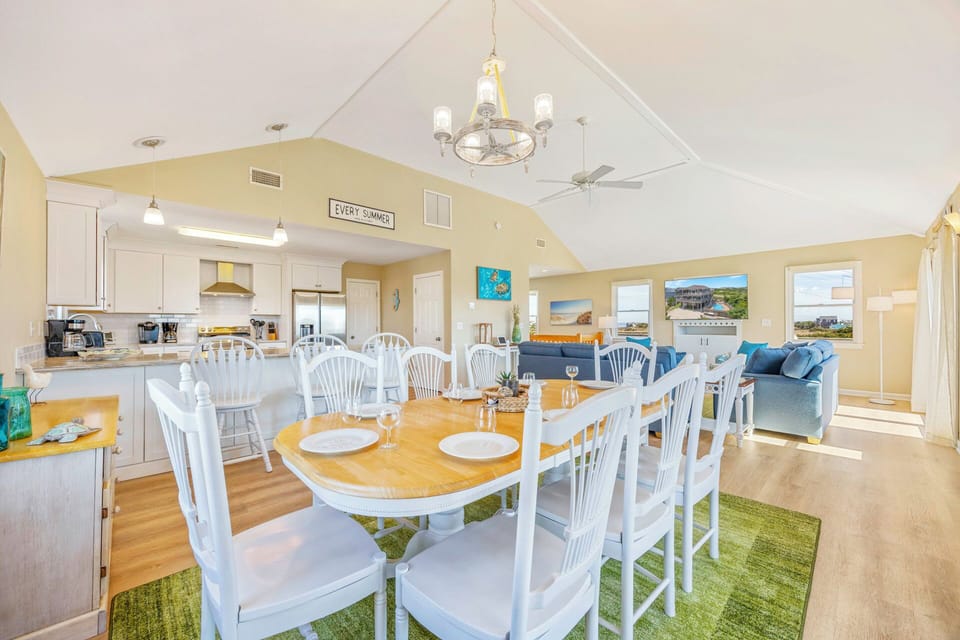 Your spacious open-concept living area flows seamlessly from kitchen to dining to lounge, perfect for gathering with loved ones under soaring ceilings.