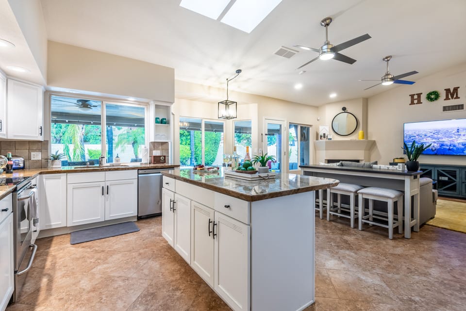 Well stocked kitchen. Sofa table provides extra seating and workspace usb ports.