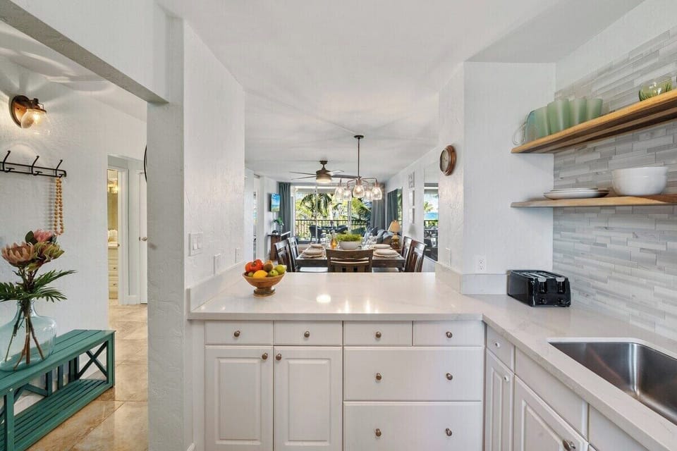 A crisp kitchen highlighted by white cabinetry and warm accents creates a bright, inviting cooking space.