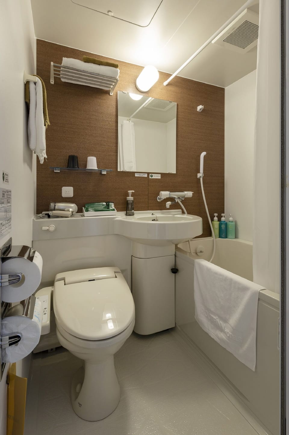 Combined shower/tub, free toiletries, hair dryer, slippers