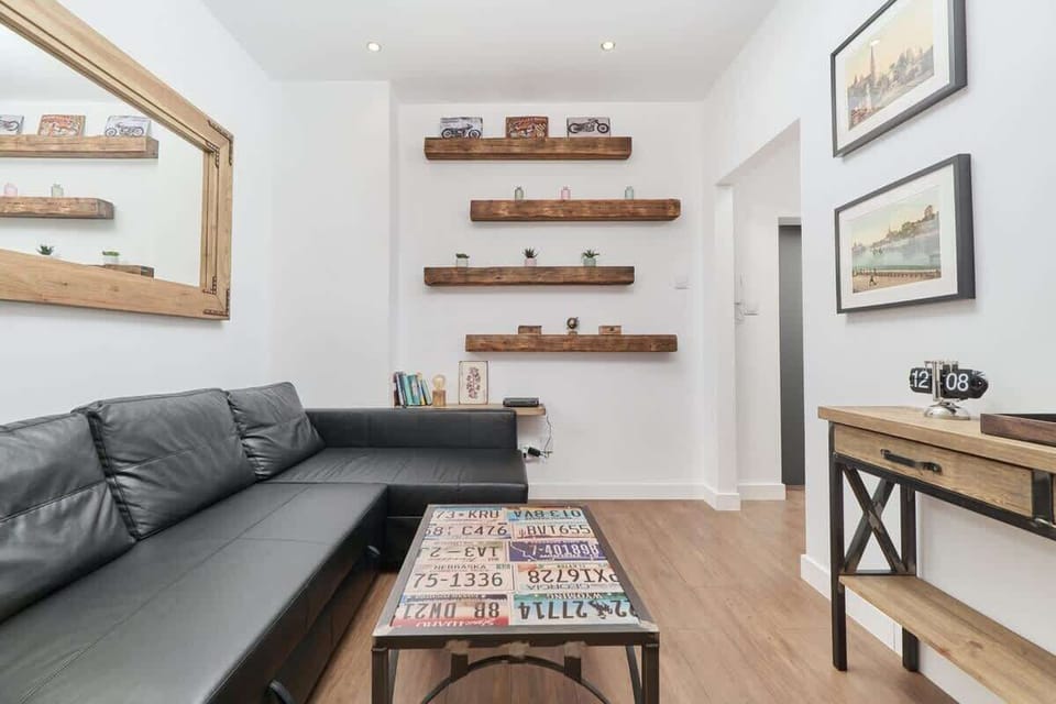 The elegant living area featuring a double sofa bed, perfect for relaxing or sleeping.