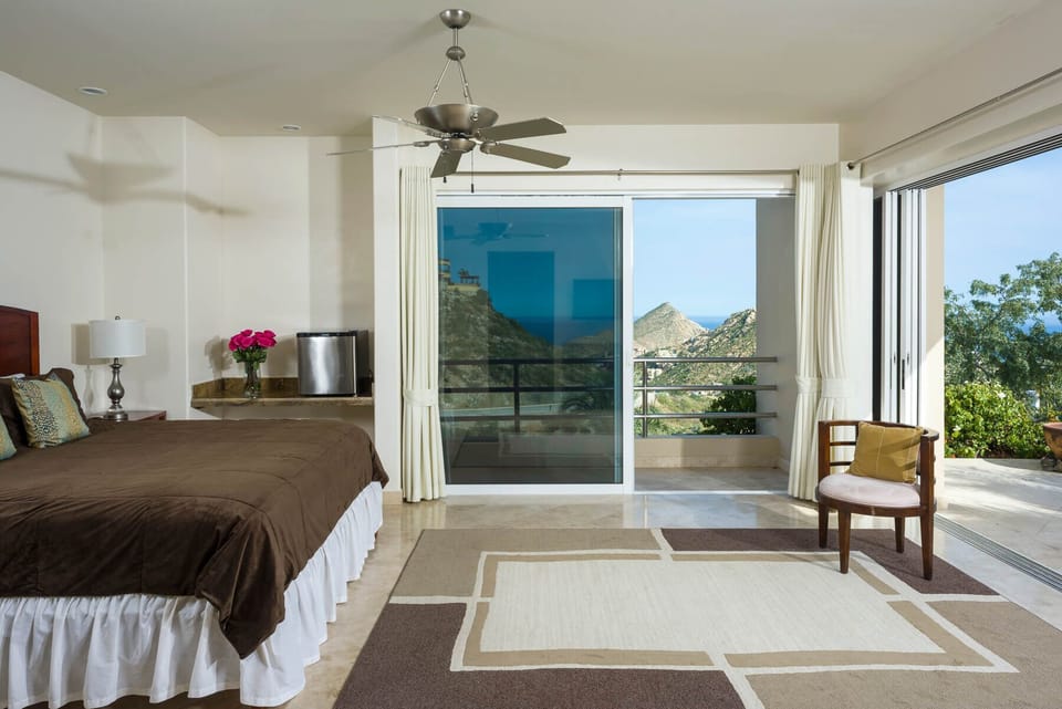Wide sliding glass doors and windows bring in plenty of warm Cabo sun to brighten and open up the rooms in Villa del Mar