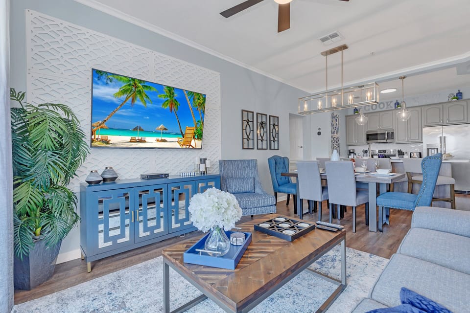 Sunny living room with big 75" smart TV.