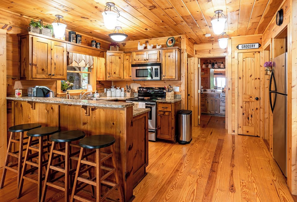 Kitchen with the guest bath, guest bedroom and laundry room just past it