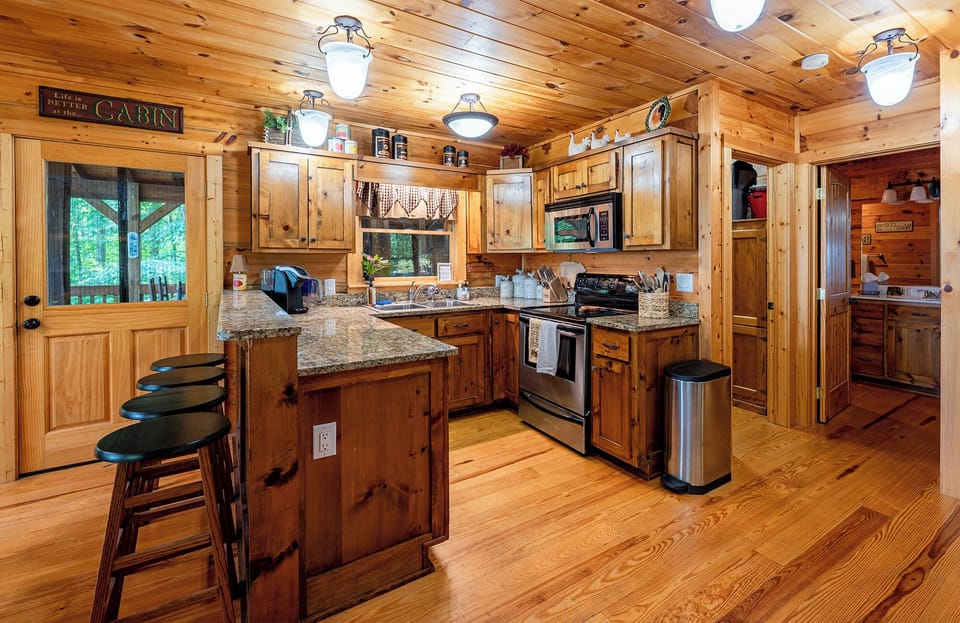 Door access to deck just to the left of the Kitchen and Laundry room just to the right