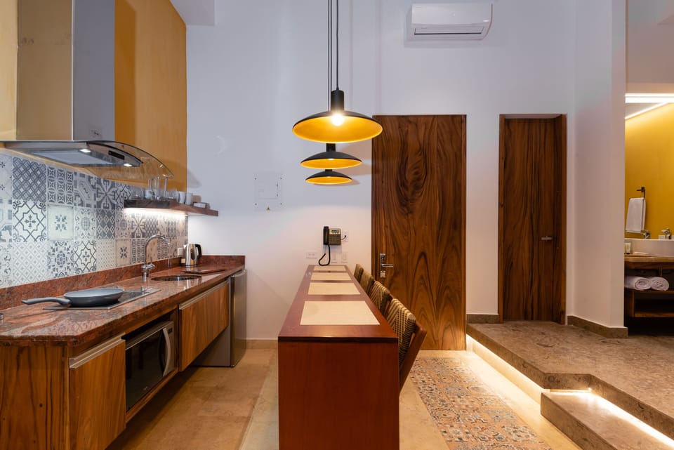 Deluxe Loft, 1 Bedroom | Private kitchen | Mini-fridge, coffee/tea maker, electric kettle