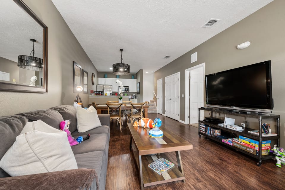 Cozy living room: Comfy sofa, big TV, movies & board games.