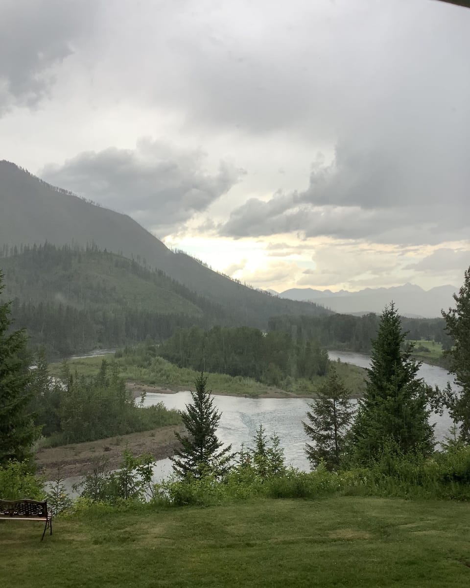 A view of the back of the home, on a rainy day. Even those are beautiful! 