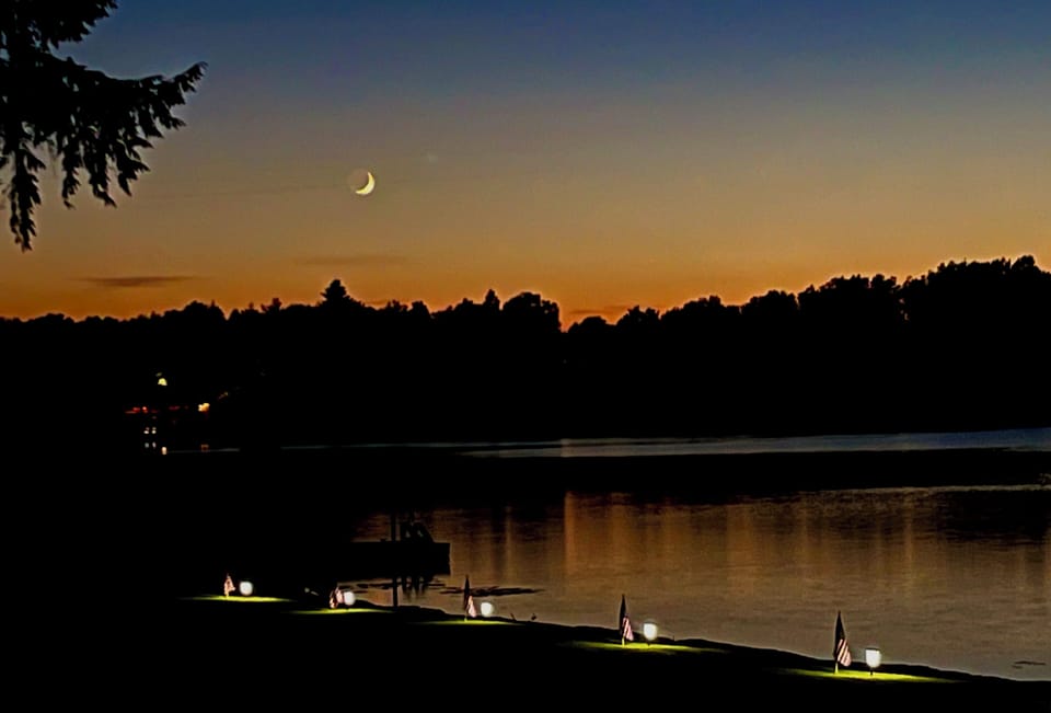 In July, the moon comes to look at the sunset