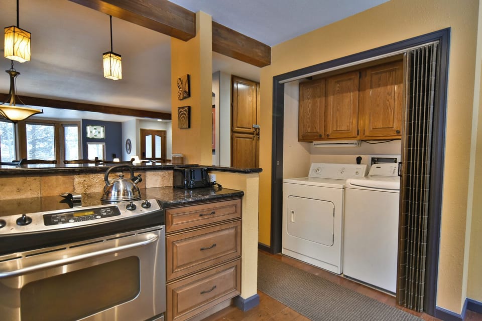 Washer & Dryer - Water/dryer unit on the main floor, accessible via the kitchen.
