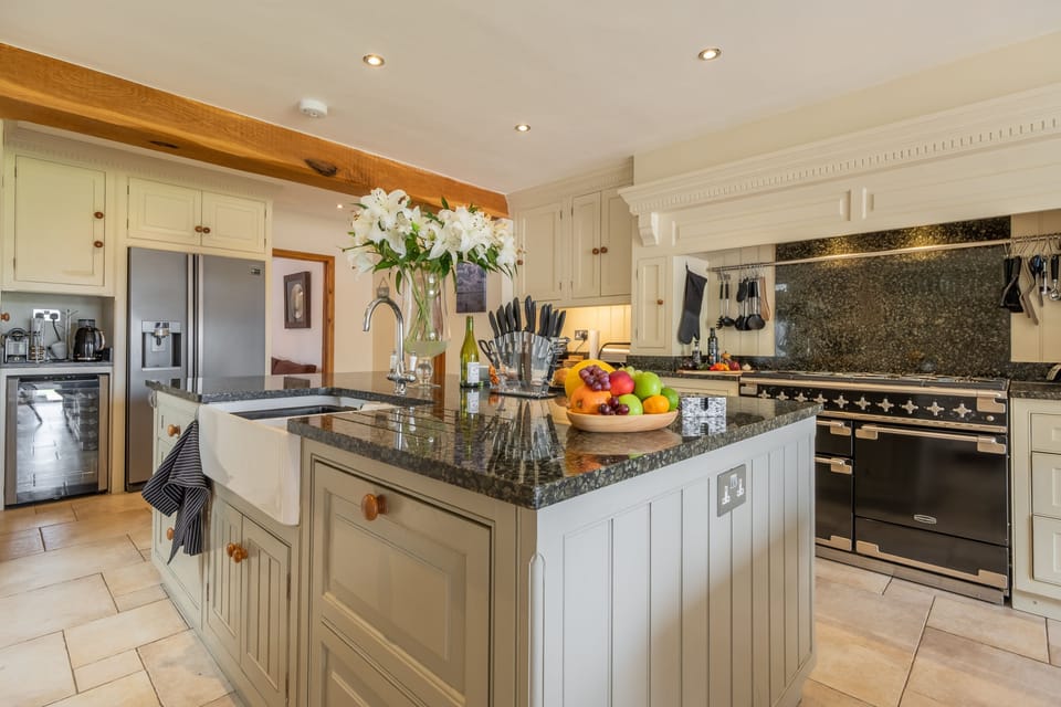 Ground floor: Spacious kitchen features a hand crafted kitchen with granite worktops