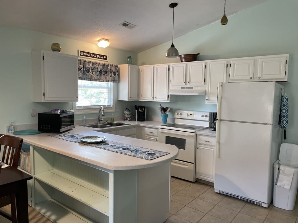 Updated kitchen with island for additional seating. 