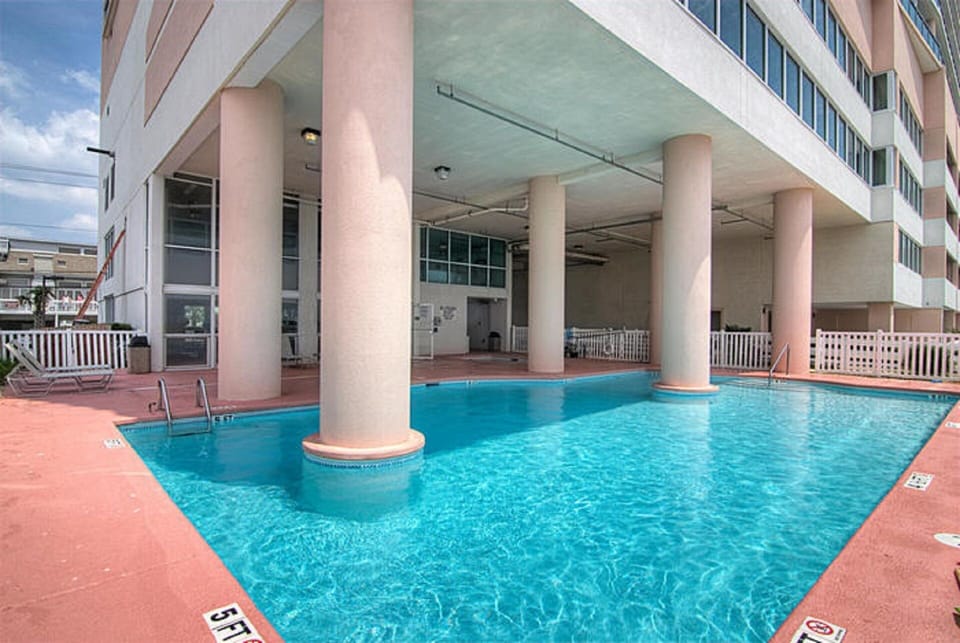 Take a cool dip in the sparkling pool after a day at the beach.