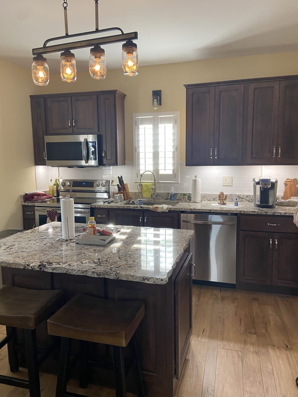 Kitchen, granite tops, custom cabinets, stainless steel appliances and hardwood 