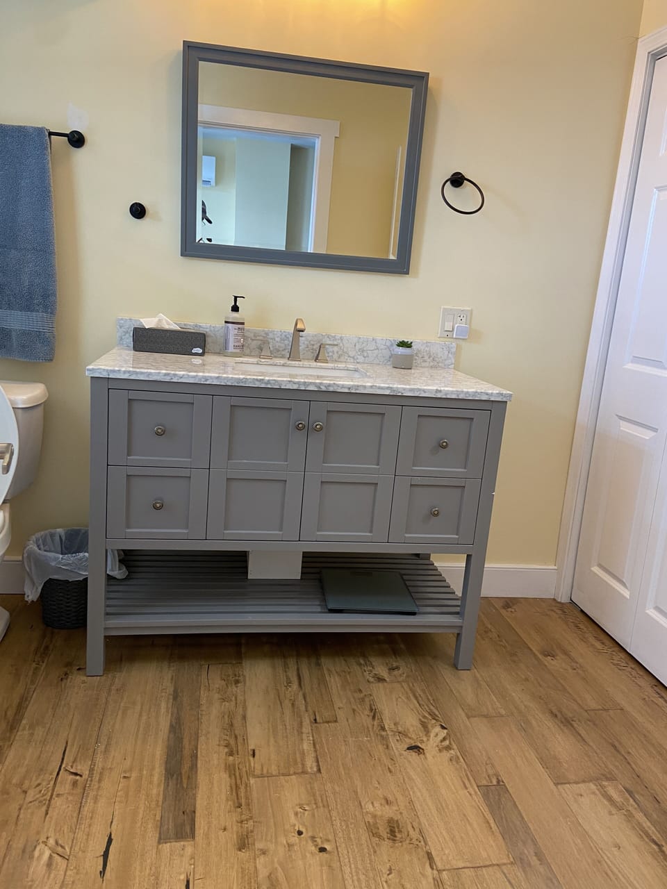 1/2 bath vanity with hardwood floor