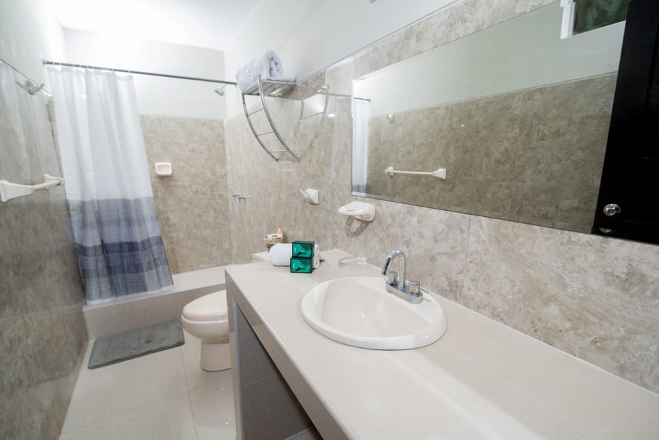Shower, designer toiletries, towels, soap