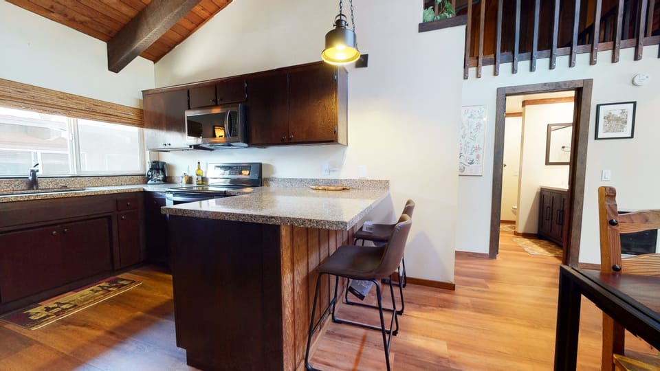 Condo, 4 Bedrooms | Private kitchen | Fridge, microwave, oven, dishwasher