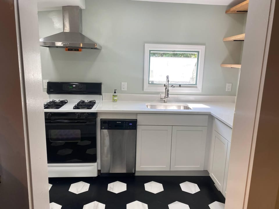 Updated kitchen with gas stove and dishwasher. 